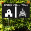 A yard sign with an image of a wall and the text 'Build This Wall: Separation of Church and State.