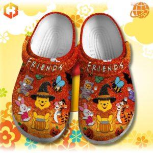 FRIENDS Winnie-the-Pooh Crocs Shoes on floral yellow background, showing Halloween-themed character designs.