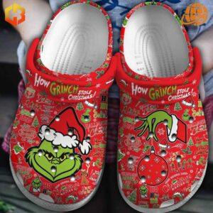 How Grinch Stole Christmas Crocs Shoes in red with festive Grinch graphics, ideal for seasonal comfort and style.