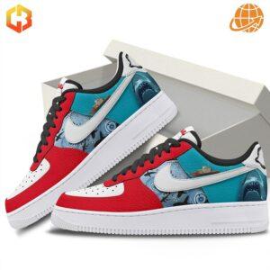 Jaws Nike Air Force Shoes partially removed from white shoebox, revealing vibrant red, teal, and white design with shark imagery.