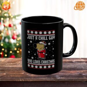 Black ceramic mug with white text reading 'Just a Chill Guy Who Loves Christmas' with subtle holiday accents