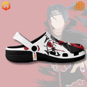 Embrace your inner ninja with the Naruto Shippuden Sharingan Itachi Uchiha Crocs Shoes. This design features striking imagery of Itachi along with the iconic Akatsuki cloud, making them a standout piece in any Naruto fan's collection.