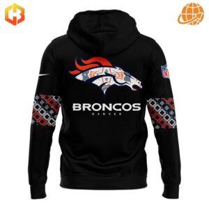 Back of Denver Broncos Native American Heritage Month hoodie with stylized team logo and patterned sleeves.