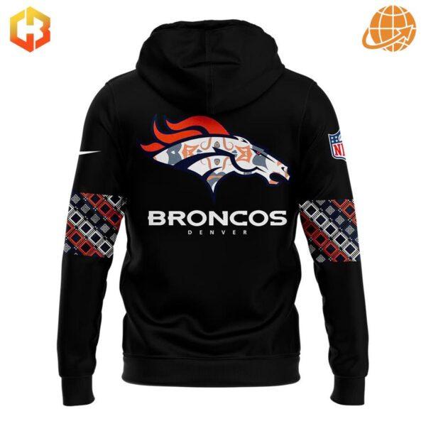 Back of Denver Broncos Native American Heritage Month hoodie with stylized team logo and patterned sleeves.