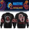 Native American Heritage Month Oklahoma Sooners Sweatshirt with tribal designs, featuring OU logo as dreamcatcher on front and large patterned OU logo on back, on black background.