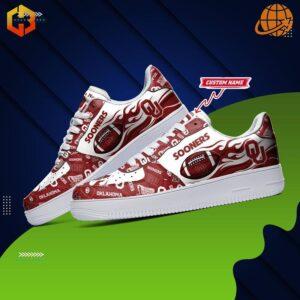 Oklahoma Sooners NCAA Nike Air Force Shoes with red and white design featuring team logos, footballs, and flame patterns on a classic Air Force 1 silhouette.