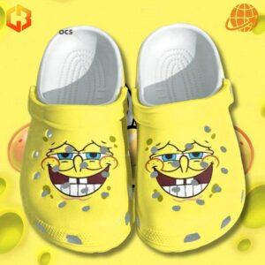 Pair of bright yellow SpongeBob SquarePants Face Crocs Shoes with SpongeBob's grinning face prominently displayed on each shoe.