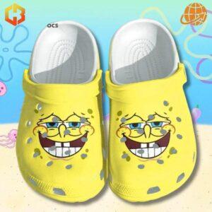 Yellow SpongeBob SquarePants Face Crocs Shoes featured on a light blue background with cartoon sea creatures and bubbles.