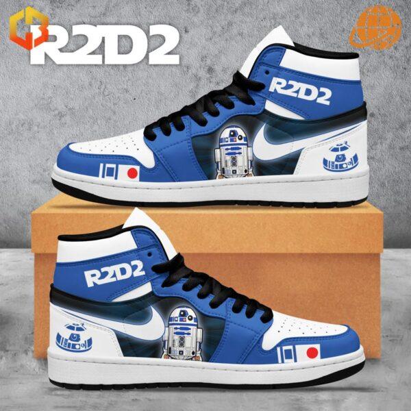 Side profile of Star Wars R2D2 Air Jordan Shoes with detailed R2D2 graphics and Nike swoosh, set against a cardboard box.