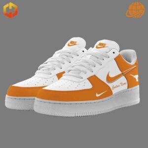 Close-up view of Texas Longhorns Nike Air Force Shoes, white with burnt orange accents, featuring Longhorns logo and customization option.