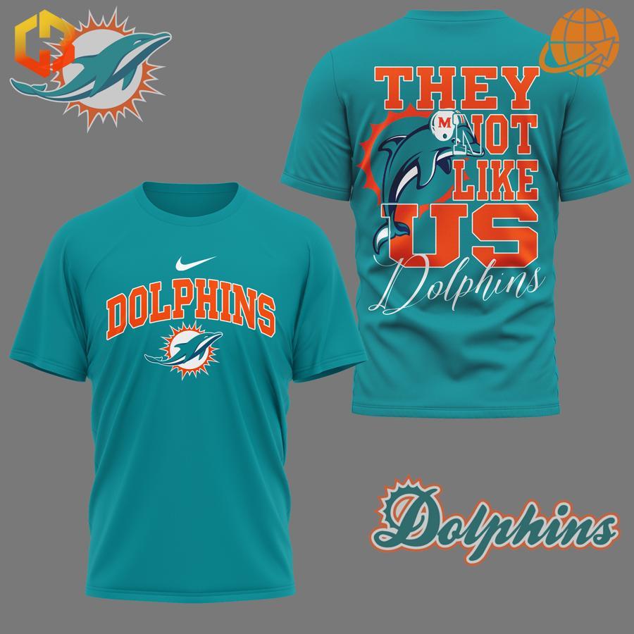 Aqua colored They Not Like Us Miami Dolphins Shirt with striking team logo and statement back