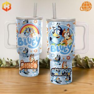 A blue and white tumbler with a design featuring Bluey and Bingo, the iconic characters from the children's show, surrounded by doodles, rainbows, and stars.