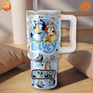 A blue and white tumbler with an all-over print design featuring Bluey, Bingo, and their friends in playful poses, surrounded by doodles and the word "Bandit."