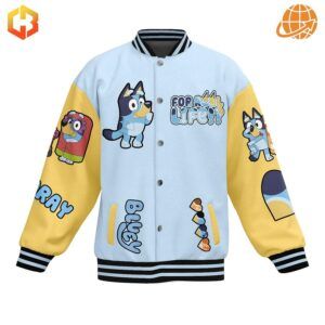 A white and yellow baseball jacket with an all-over print featuring Bluey, Bingo, and their friends, along with quotes and illustrations from the show.