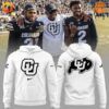 Colorado Buffaloes football players wearing white and black hoodies with CU logo and American flag design.