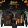 Dallas Cowboys Black History Month Hoodie with African-inspired designs and raised fist symbol