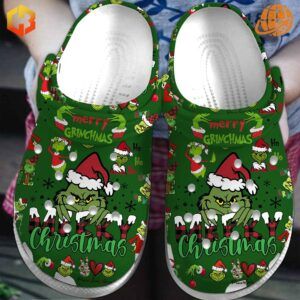 Green Grinch-themed Crocs clogs with festive Christmas designs and characters.