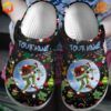 Step into holiday cheer with these personalized Grinch Custom Crocs Clogs, featuring festive designs and your name.