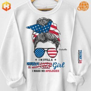 Sweatshirt with a stylish and patriotic graphic of a woman’s head adorned with American flag accessories, bold typography stating 'Trump Girl' and additional Trump-themed accents