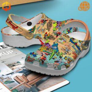 Jimmy Buffett Margaritaville Crocs Shoes on blue background with product box and promotional materials.