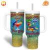 Jimmy Buffett This One's For You Stanley Tumbler featuring colorful parrots and tropical imagery.