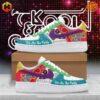 Colorful Kool & The Gang Party Nike Air Force Shoes displayed on box against pink pixelated background.