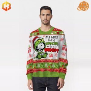 Person wearing the In A World Full Of Grinches Be A Snoopy Christmas Sweater.