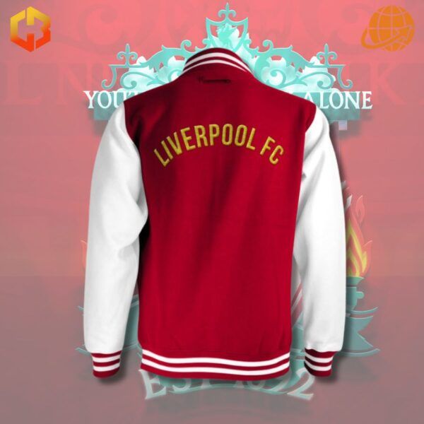 Close-up of a Liverpool FC baseball jacket, showcasing the team crest and colors.