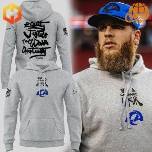 Los Angeles Rams NFL Inspire Change hoodie displayed next to a bearded player in team cap.