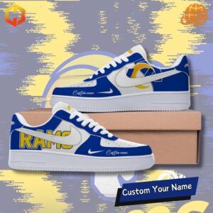 A pair of custom Nike Air Force 1 sneakers in the Los Angeles Rams team colors, featuring the team logo and the word "Rams."