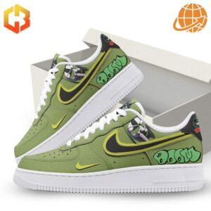 Pair of MF Doom Green Air Force 1 Shoes with white box background.