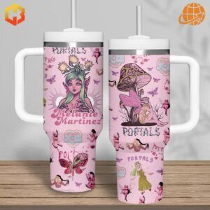 Two pink Stanley Tumblers with Melanie Martinez-inspired artwork, displaying fairy characters and mushroom scenes.