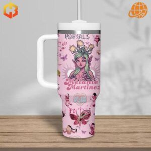 Close-up of Melanie Martinez pink Stanley Tumbler featuring a green-haired fairy character and artist's name.