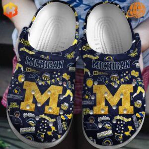 Step into team spirit with these eye-catching Michigan Wolverines football Crocs, featuring a vibrant collage of university symbols and the iconic "M" logo.