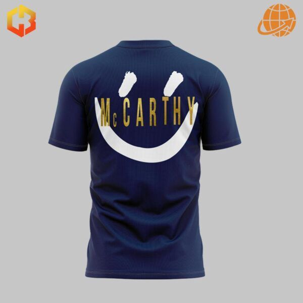 Back view of navy Michigan Wolverines McCarthy t-shirt with large smiley face logo.