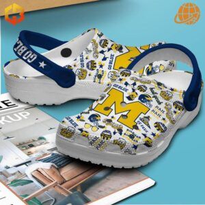 Close-up of Michigan Football Go Blue Crocs Shoes featuring bold “Go Blue” strap and maize “M” logo.