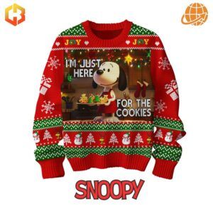 Spread holiday cheer with the Snoopy "I'm Just Here For The Cookies" Christmas Sweater - a perfect blend of humor and festive style!