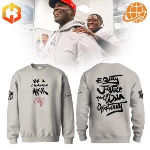 Front view of the NFL Inspire Change Tampa Bay Buccaneers Be A Change Maker Sweatshirt with bold "Be A Change Maker" text and Buccaneers logo.