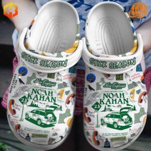 Pair of Noah Kahan Stick Season Crocs Shoes highlighting durable Croslite™ material and album-themed graphics.