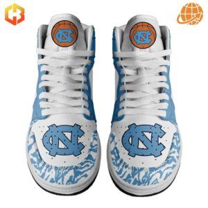 Close-up of UNC Tar Heels Air Jordan 1 shoes showing NC logo and basketball design elements.