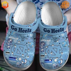 Light blue North Carolina Tar Heels Crocs Shoes featuring detailed UNC-inspired collage design.