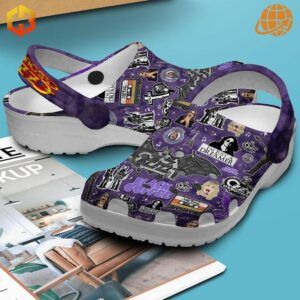 Purple Ozzy Osbourne Crocs Shoes featuring detailed rock-inspired collage design on blue backdrop.