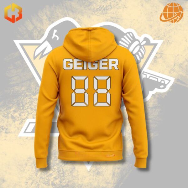 A yellow hoodie with a penguin graphic and the John Geiger logo.