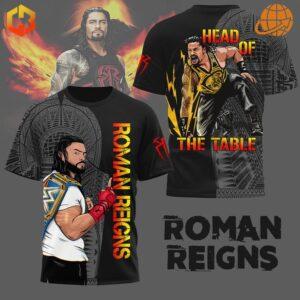 The front of the shirt features a vibrant illustration of Roman Reigns, with bold lettering spelling "ROMAN REIGNS" alongside intricate patterns.