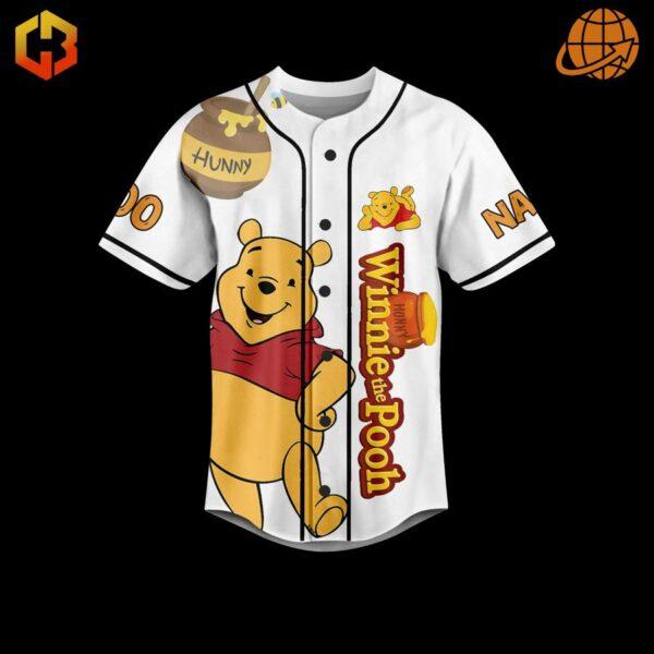 Yellow baseball jersey with Winnie the Pooh and a honey pot graphic.