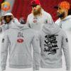 San Francisco 49ers players wearing grey hoodies with "Be a Change Maker" and social justice messages.