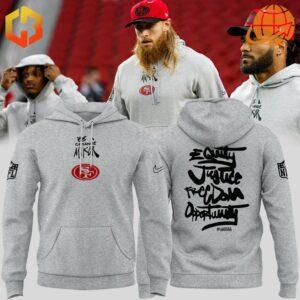 San Francisco 49ers players wearing grey hoodies with 