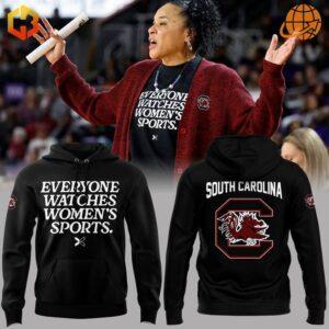 A hoodie featuring the text 'South Carolina Gamecocks' and 'Everyone Watches Women Sports' with bold lettering