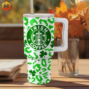 Starbucks Irish Coffee Lucky Stanley Tumbler featuring Irish Coffee logo and festive green design, set in an autumn scene.