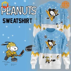 Pittsburgh Penguins Peanuts Snoopy Night Sweatshirt with team logo and Snoopy playing hockey.